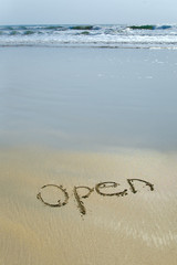 open written in sand