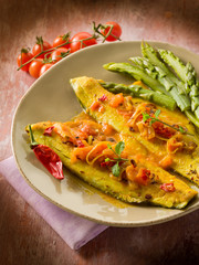 fish fillet with tomato hot chili pepper and asparagus