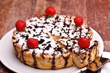 Cheesecake Decorated With Chocolate And Strawberries
