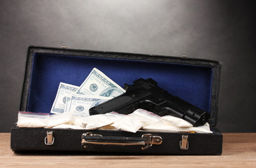 Cocaine, dollars and handgun in case