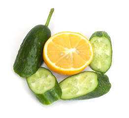 sliced ​​cucumber with lemon on a white background
