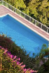 Fototapeta na wymiar Blue Pool In The Summer Sun