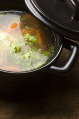 Chicken soup in the ceramic bowl