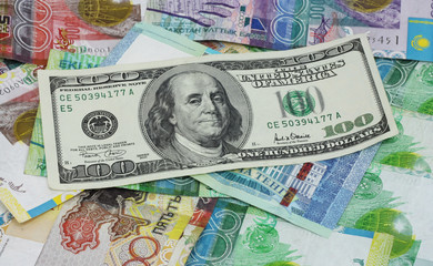 Fototapeta na wymiar American dollars and Kazakhstan tenge pell-mell