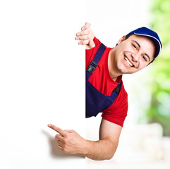 Worker pointing a blank sign
