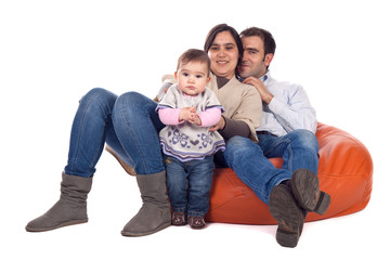 Happy family of parents and daughter in causal clothes