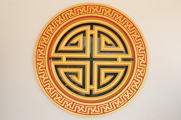 golden circle wooden window in temple