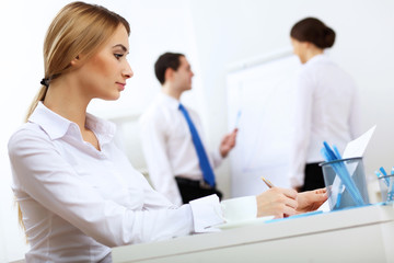 Obraz premium Portrait of a business woman in office