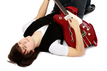 A lying on the floor man with a guitar