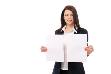 Fototapeta premium young woman in a jacket and blouse, shows two white sheets, isol