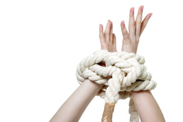 female hands tied up with rope over white