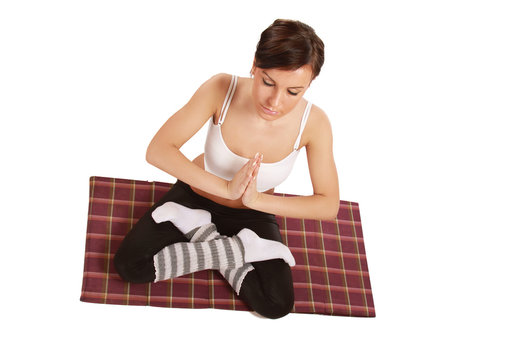 A Young Woman Doing Yoga, Isolated, On White, From Above