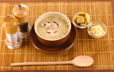 Tasty soup on wooden mat