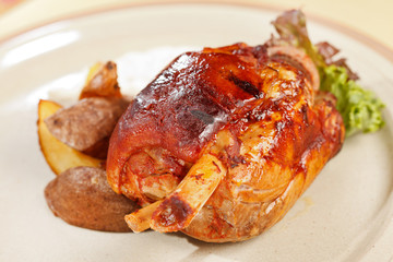 roasted pork knuckle with potatoes