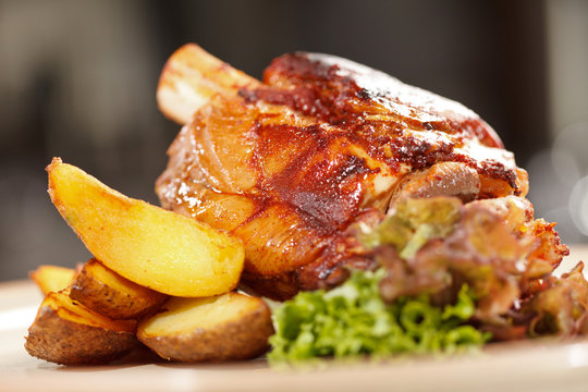 roasted pork knuckle with potatoes