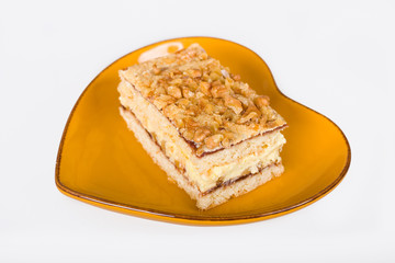 Nut cake on a heart shaped plate