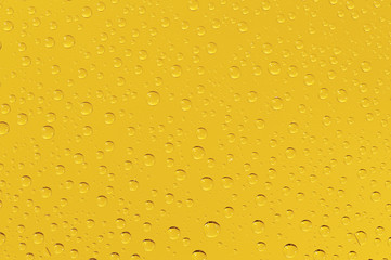 Many water drops on the yellow background