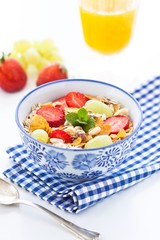 Breakfast with muesli and fresh orange juice