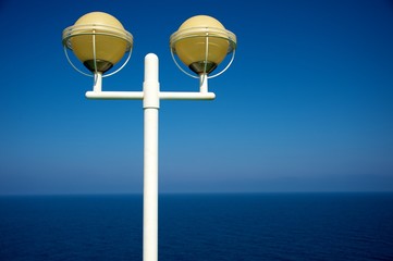 Streetlight against sea view