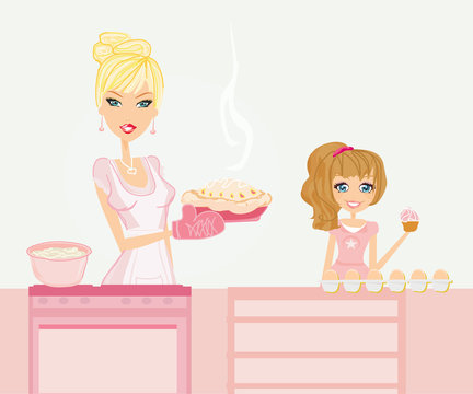 Happy mother helping her daughter cooking in the kitchen