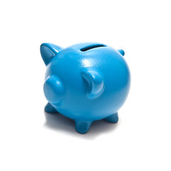 Blue piggy bank isolated on a white studio background.