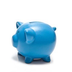 Blue piggy bank isolated on a white studio background.