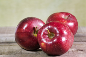 red apples on wooden table