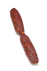 Chorizo De Pueblo sausage isolated on a white studio background.