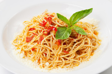 pasta with sweet bell pepper, basil leaf and  parmesan, on white