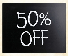 "50% off" handwritten with white chalk on a blackboard