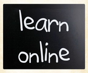 "Learn online" handwritten with white chalk on a blackboard