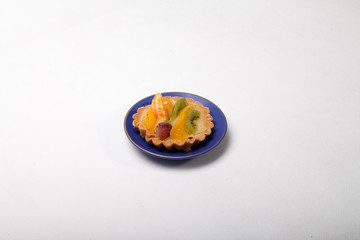 sweet cake with fruits isolated on white