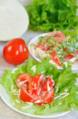 Tomatoes with mayonnaise on lettuce leaf