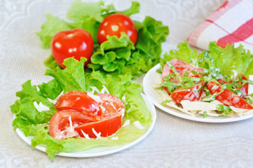 Tomatoes with mayonnaise on lettuce leaf