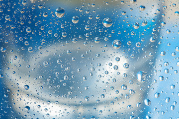 the outlines of glass through water droplets