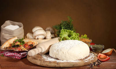 delicious pizza dough, spices and vegetables