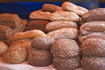 assortment of baked bread on market