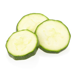 Sliced zucchini on white, clipping path included