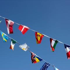 Multicountry bunting against a blue sky