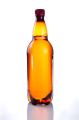 Isolated Brown plastic bottle of beer drink without label on a w