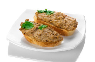 Fresh pate on bread on white plate isolated on white