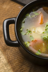 Chicken soup in the ceramic bowl