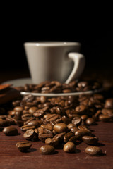 Coffee beans close-up at wooden table