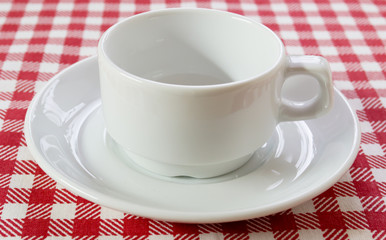 white coffee pair on checkered tablecloth