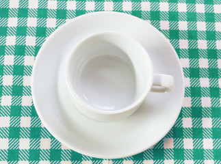 Obraz na płótnie Canvas white coffee pair on checkered tablecloth