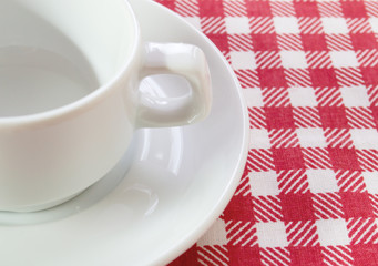 white coffee pair on checkered tablecloth