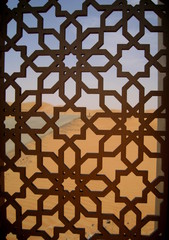 Desert sands seen through a lattice screen