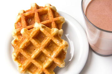 glass of cacao and cookies on white background