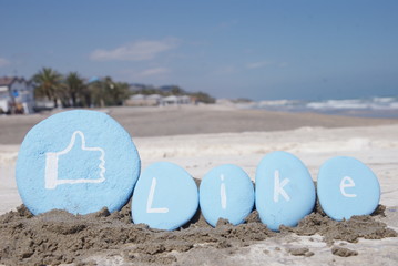 like word over some pebbles on the sand