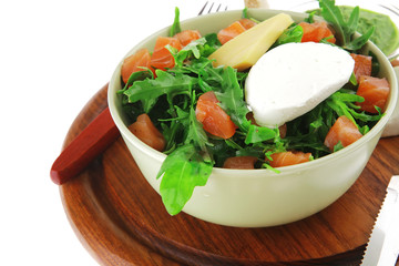 salad with smoked salmon in green bowl